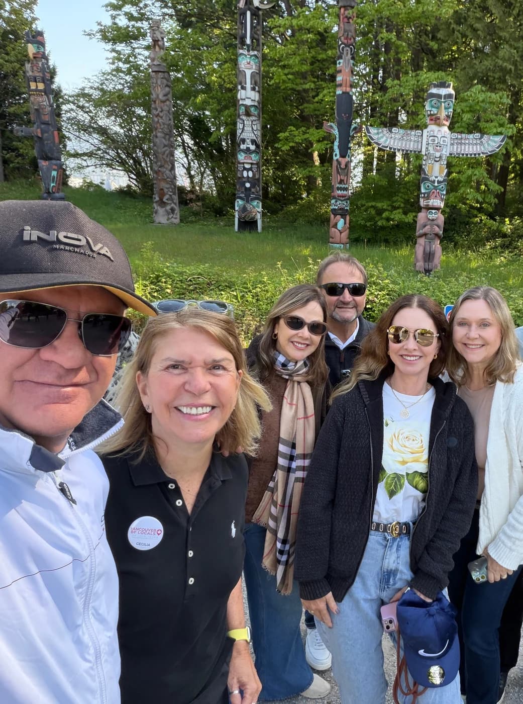 Local guide and group of clients smiling during a city tour in Vancouver