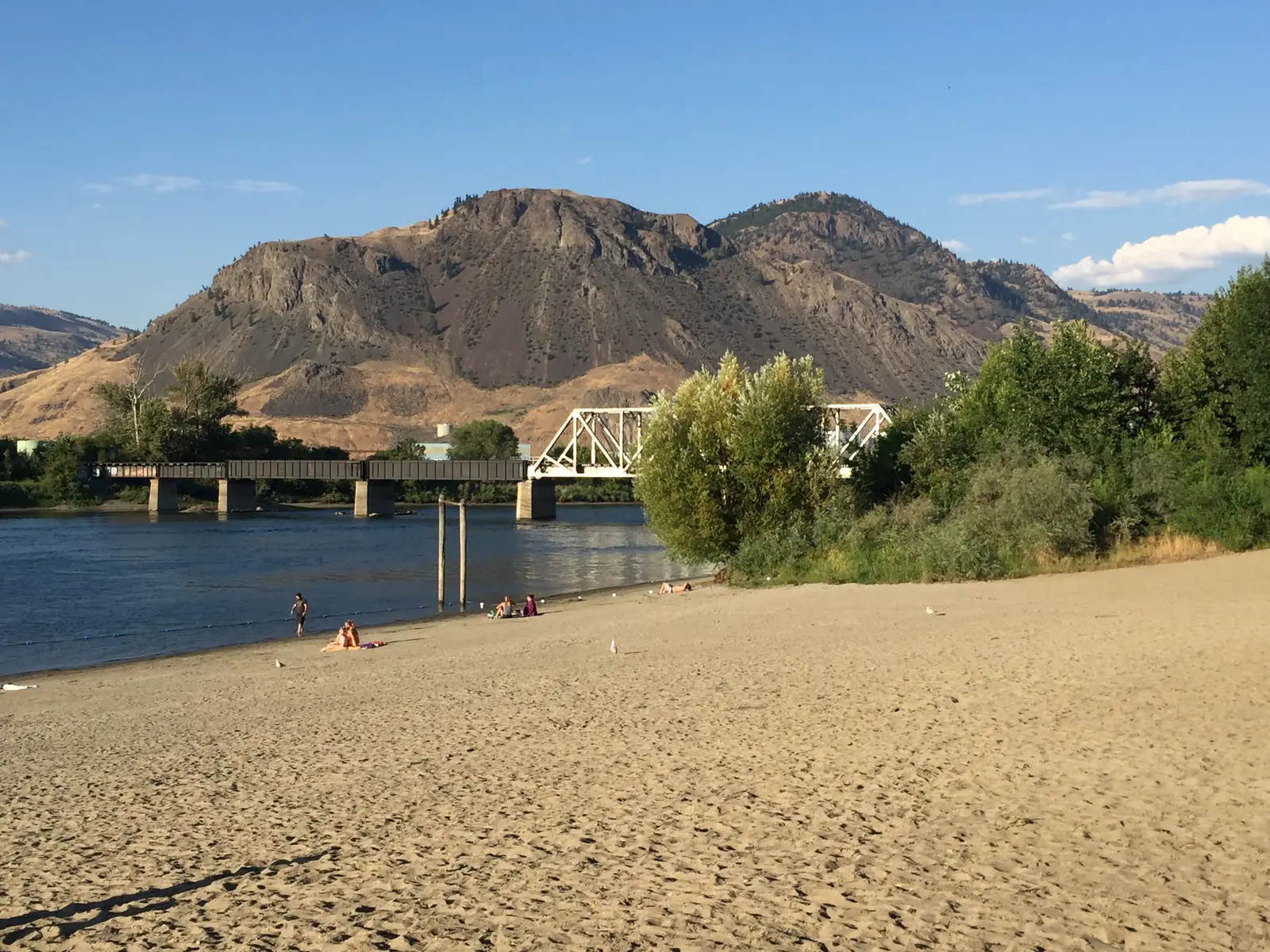 Sandy beach along the Thompson River in Kamloops, a stop on the Vancouver to Calgary route