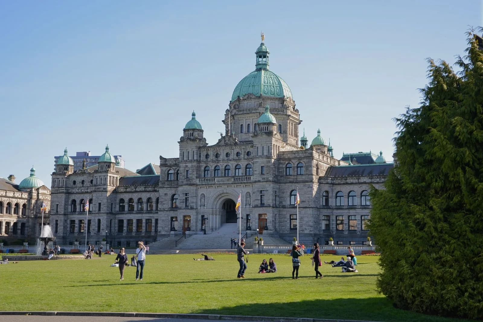 BC Parliament Buildings with fountain and lawn in the foreground, in Victoria